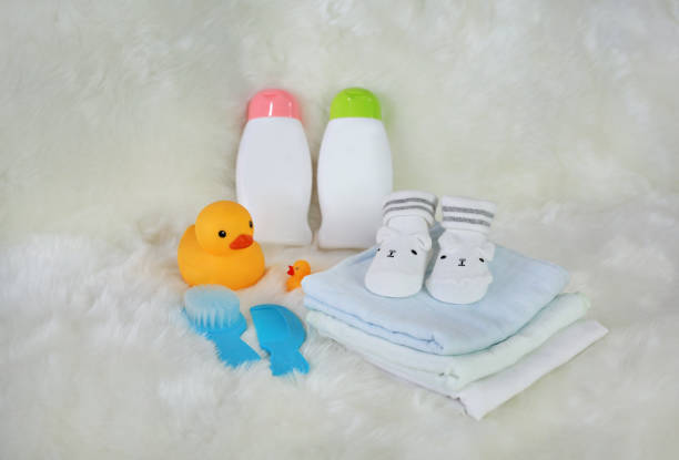 istock Children's bath products and hygiene items on white fur. 887083036