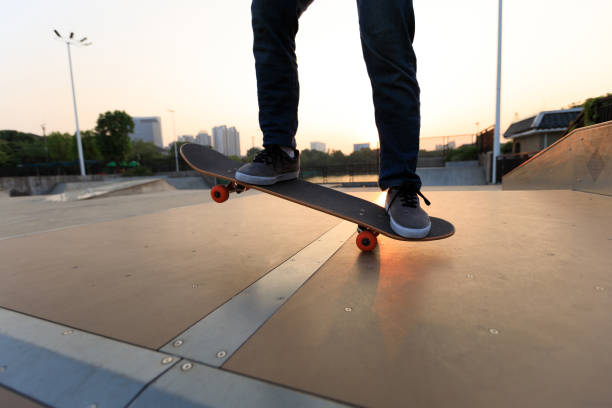 istock skateboarder legs skateboarding on skatepark ramp 887083130