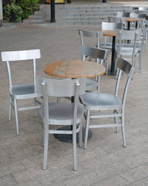 istock Circle wood table set with aluminium chair. 887083596