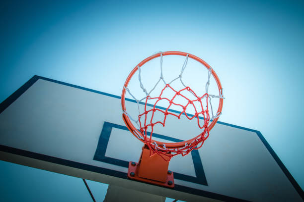 istock Basketball hoop at blue sky 887088810