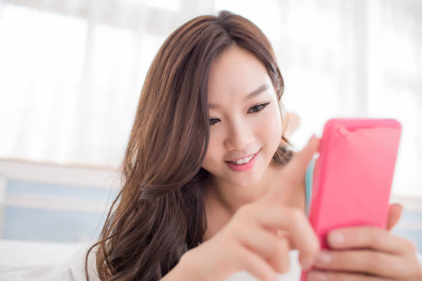 istock woman use phone 887091074