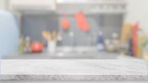 istock White stone table top and blurred kitchen interior background - can used for display or montage your products. 887091214