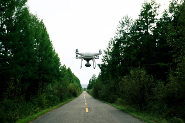 istock drone flying over trail in the autumn forest 887098094