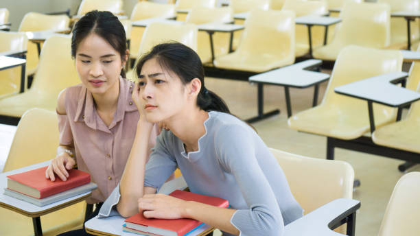istock student girl feel sleepy in the classroom. 887098106