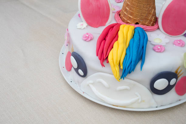 istock Homemade birthday cake unicorn on a table 887100628