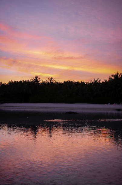 istock Tropical Sunset and island silhouette 887106880