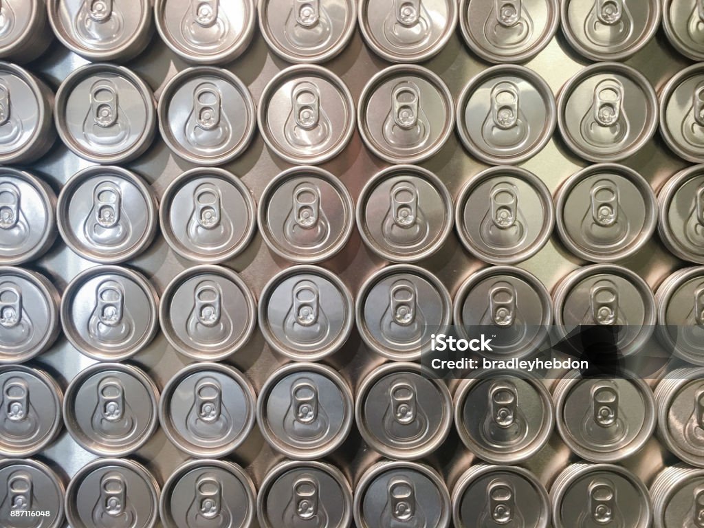 Collection of beer cans from above A shiny collection of beer cans are photographed from above and serve as a great background for food and drink concepts, or even recycling. Shot on an iPhone 6s Plus. Aluminum Stock Photo