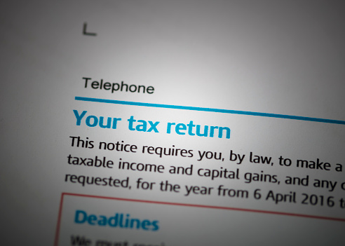 A stock photo of the UK Inland Revenue Tax forms.