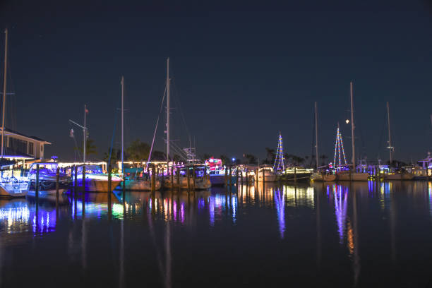 Boats with Christmas lights Boats lit up with Christmas lights parked at the dock in Venice Florida parade stock pictures, royalty-free photos & images