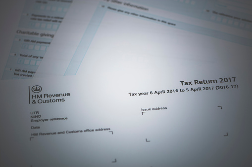An editorial stock photo of the UK Inland Revenue Tax forms.