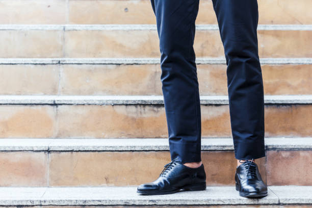 istock Businessman walking on the stairs 887133196