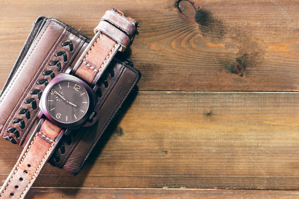 istock Leather wallet and watch on wooden background - Man accessories 887144030