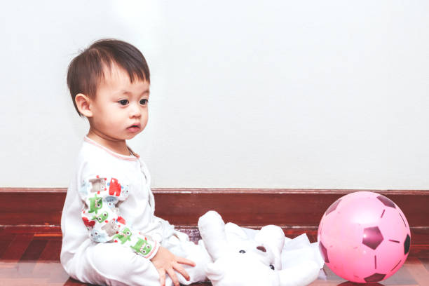 istock Happy little baby boy with toy 887144044