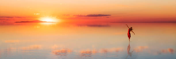 istock beautiful ballet dancer is dancing on the lake in the evening 887161260