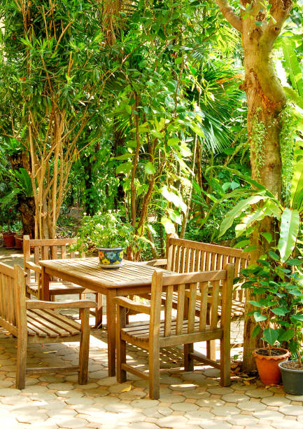 istock garden table set in green garden 887164002