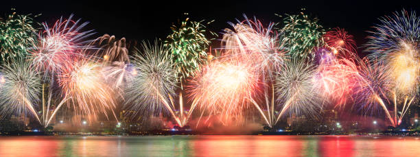 istock Brightly Colorful Fireworks isolated black background. New Year celebration fireworks. 887164208