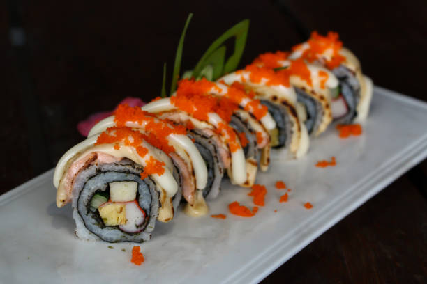 istock Delicious Grilled Salmon Roll with Ebigo on the Top 887164514