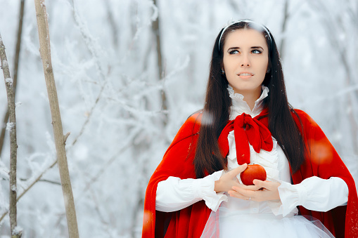 Pretty princess in fantasy ice wonderland landscape