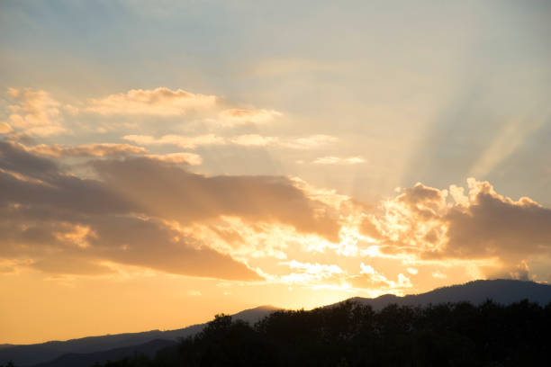 istock Beautiful sunset with orange sunlight,mountain landscape under cloud sky,tranquility sunset wallpaper 887167266