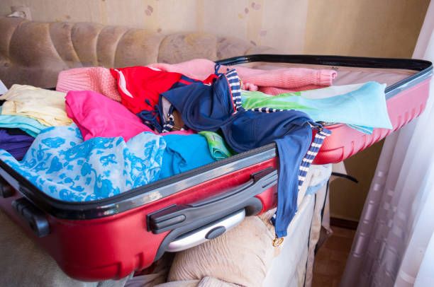 istock Charges for the journey, an open suitcase with women's things 887173404