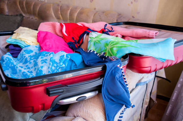 istock Charges for the journey, an open suitcase with women's things 887175918