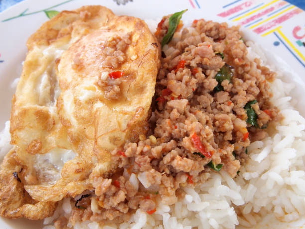istock Close up Rice topped with stir fried pork and basil 887180600