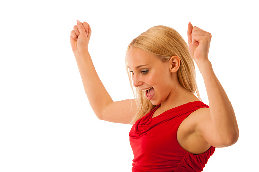 Successful business woman gestures success with hands rised in the air isolated over white background