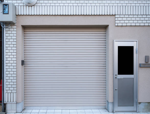 istock Garage with door residence on white brick 887186478