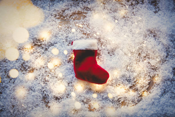 istock Santa Claus sock and Fairy Lights 887195032