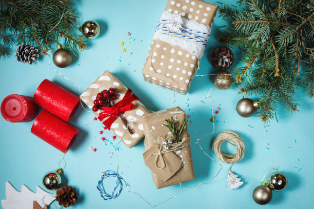 istock Christmas background with decorations and gift boxes on blue board. 887209046