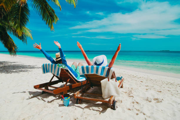 istock happy couple relax on a tropical beach 887209136
