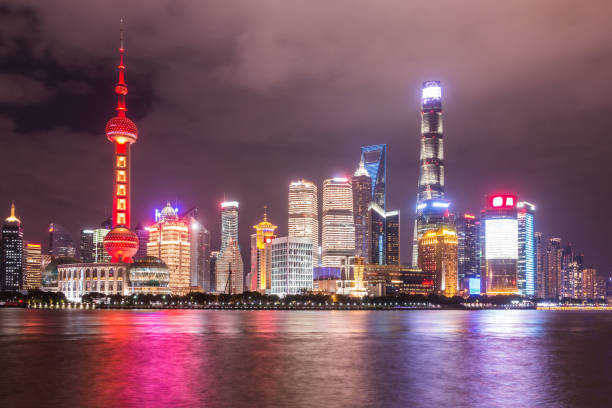 istock Shanghai skyline night view on Huangpu river, China 887217668