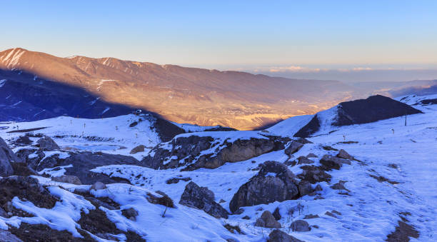 istock The setting sun in the snow-capped mountains 887221346