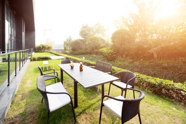 istock table and chairs near modern building with sunbeam 887227578