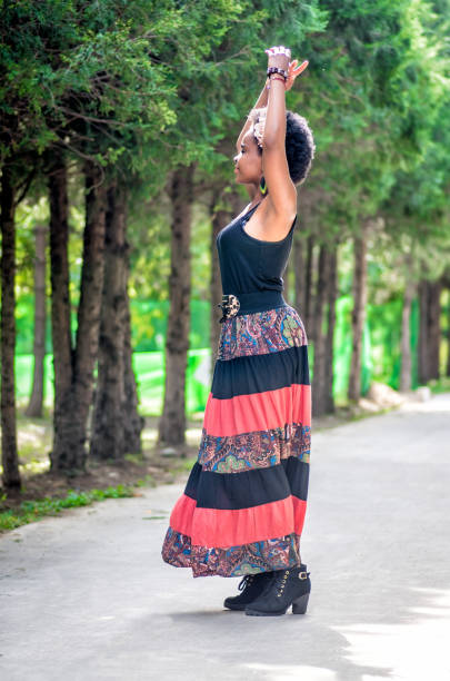 istock african girl is dancing on the meadow 887227888
