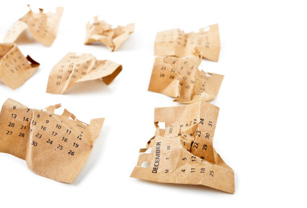 istock December. Calendar sheets. Crumpled paper on the white floor. 887232644