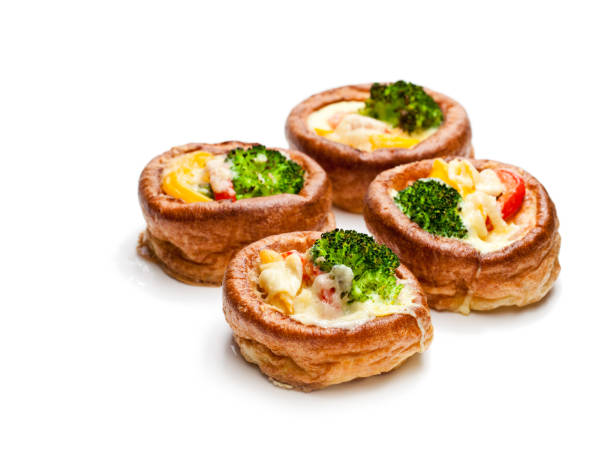 yorkshire  puddings stuffed with broccoli and scrambled eggs isolated on white background - yorkshire pudding imagens e fotografias de stock