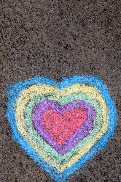 istock chalk drawing: colorful hearts on asphalt 887236560