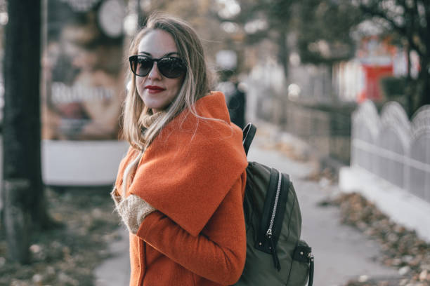 istock Stylish blonde in the city 887237574