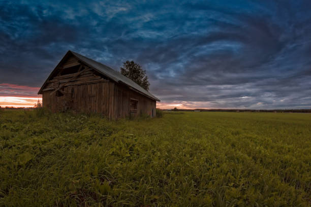 istock Old Barn House Under The Dramatic Summer Skies 887239484