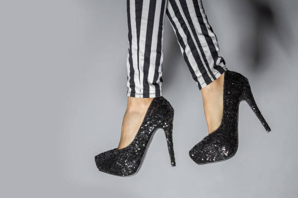 istock Sexy legs on gray background 887239736