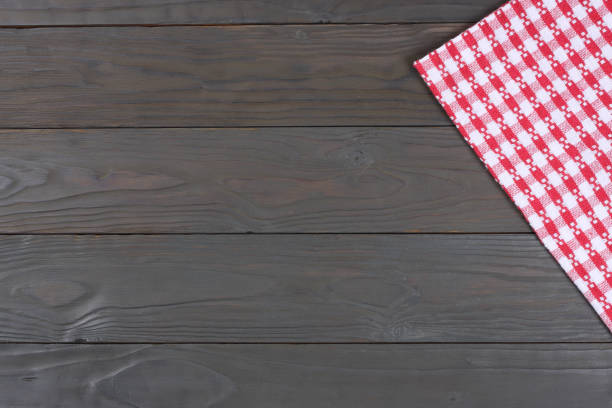 istock red cloth on dark wooden background with copy space. Top view. 887243392
