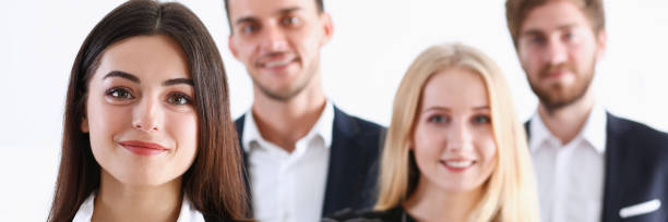 istock Group of smiling people stand in office 887245956
