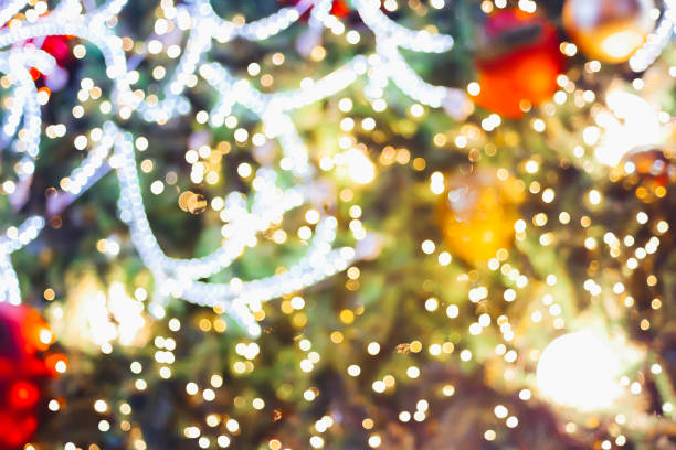 istock LED light on Christmas tree with bokeh blur for Christmas and new year day 887245974