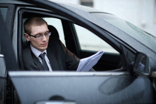 istock Man in a business suit in the car 887246170