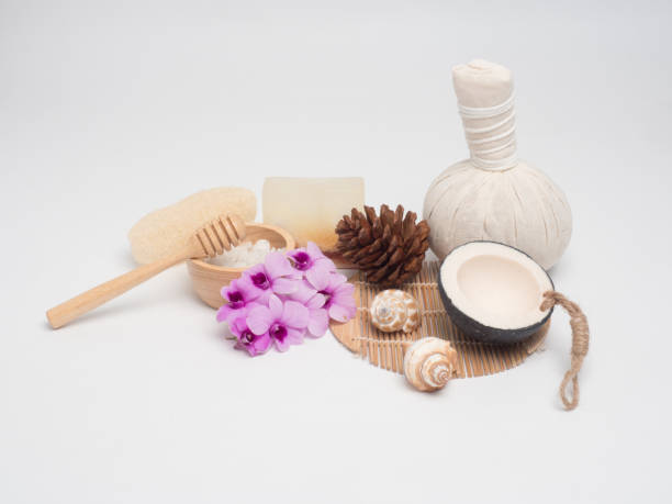 istock Spa set ,candle,coconut,flower,soap ,massage, with wood white background (top view) 887246214