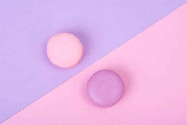 istock Small French macaroons on pastel background 887246670
