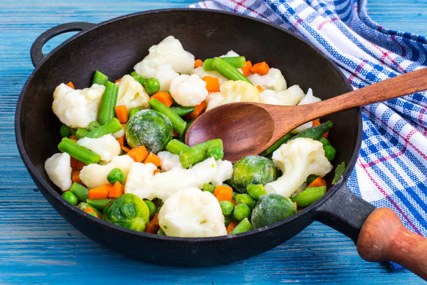 istock Pan with frozen vegetable mix for frying 887262862