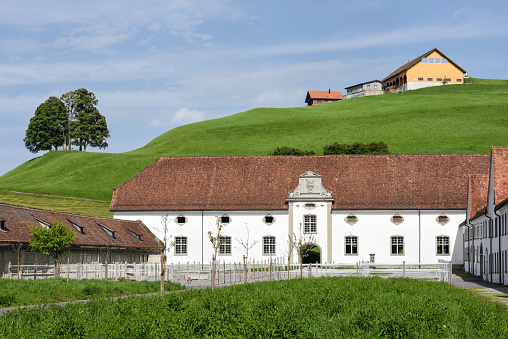 Einsiedeln, Switzerland - 3 August 2017: Einsiedeln abbey in front of farmland on Switzerland