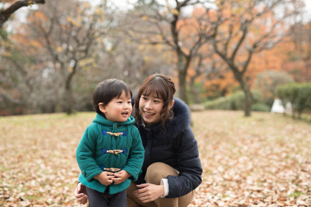 istock mother, son, and autumn leaves 887275568